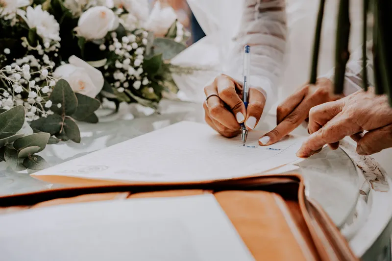 Couple discussing Antalya wedding date hold 2027 options with a planner